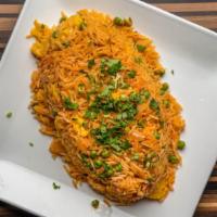 Vegetable Rice · Basmati rice cooked with herbs and spices.