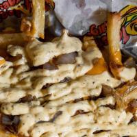 West Coast Style Fries · Nacho cheese, grilled onions, taystee sauce.