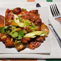 Anv3 - Chilli Chicken · boneless Chicken pieces sautéed with onions, green pepper, and finished in-house made chilli...