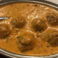 Ev10 - Malai Kofta · Cottage cheese, potatoes, and spices mixed together and then finished in hot oil and served ...