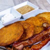 Homemade Potato Pancakes (4) · Served with two bacon strips and applesauce.
