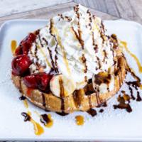 Waffle Sundae · Layered with Strawberries, Bananas & a Scoop of Vanilla Ice Cream. Finished with whipped Cre...
