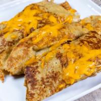 Scrambler Crepes · Three Crepes filled with Scrambled Eggs, Diced Ham and Cheddar cheese