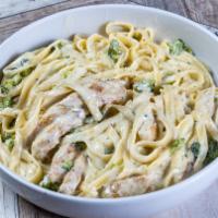 Fettucine Alfredo · Fettuccine noodles sauteed in fresh Alfredo sauce with Broccoli & Parsley. Served W/ Garlic ...