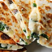 Spinach Quesadillas · Made with spinach, grilled onions, tomatoes, mushrooms, and chipotle sour cream.