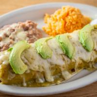 Burrito Supreme Dinner · Topped with green mole, melted cheese, and avocado. Choice of meat: steak, chicken, shredded...