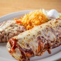Burrito Suizo Dinner · Made with your choice of meat, beans, lettuce, tomatoes, melted cheese, sour cream topped wi...