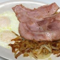 Breakfast  Special  · Eggs With the choice of ham, four bacon, or four sausages, choice of hash browns or grits, t...