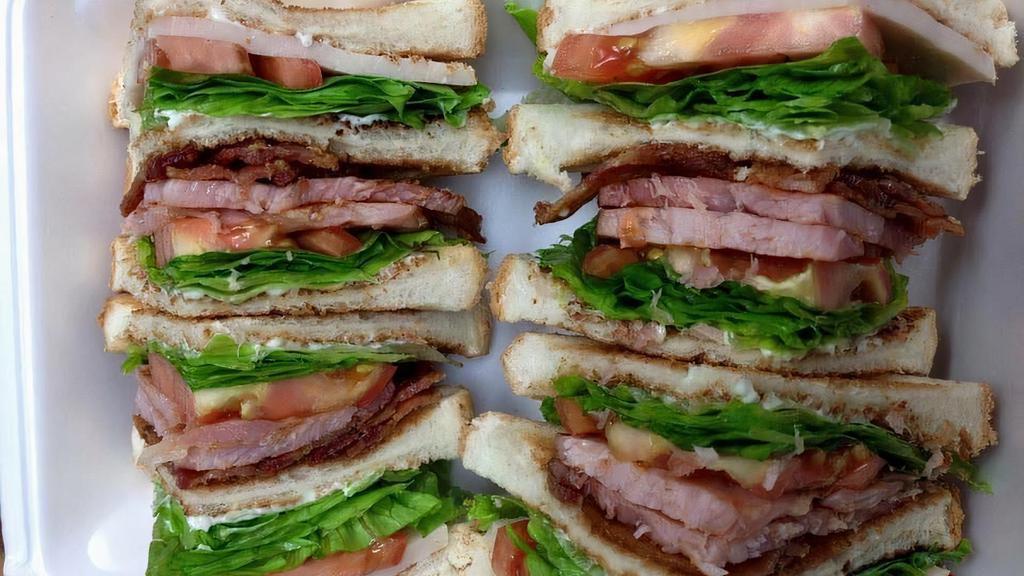 Club Sandwich · With ham turkey bacon lettuce tomatoes and mayo.