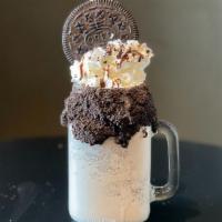Oreo Explosion · A to go cup filled with rich vanilla ice cream and crushed Oreo. Topped with a large frostin...