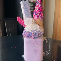 Unicorn Horn · A to go cup filled with rich vanilla ice cream blended 
with cotton candy sprinkles. Topped ...
