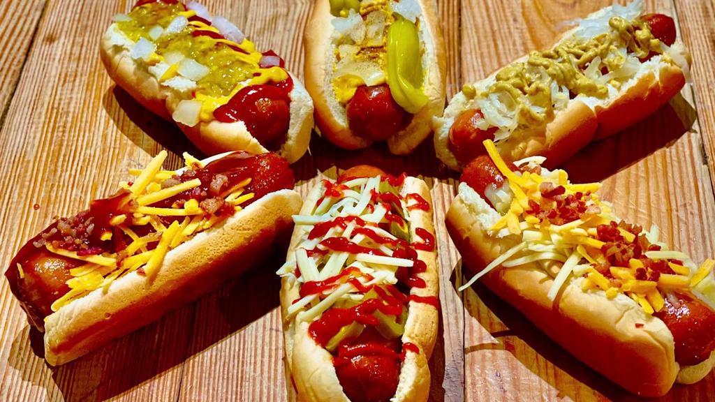 Classic Dog · Huge quarter pound hot dog (twice the size of your typical backyard hotdog, on a soft bun with ketchup, Yellow Mustard, Onions and Relish