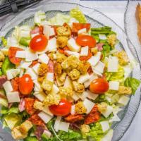 Antipasto Salad · Crisp lettuce accented by fresh tomatoes, onions, green peppers, green olives, salami, peppe...