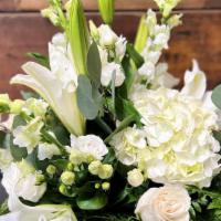 Hope, Grace, Faith Arrangement  · Elegantly arranged white Hydrangeas, lilies, snap dragons and lisianthus mixed in with lush ...