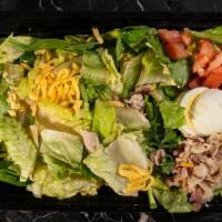 Chefs Salad · Fresh lettuce and spinach with eggs, tomatoes, bacon pieces, and cheese.