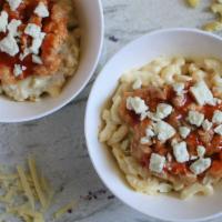 Buffalo Chicken Macaroni & Cheese · Topped with chicken, buffalo drizzle and blue cheese crumbles.