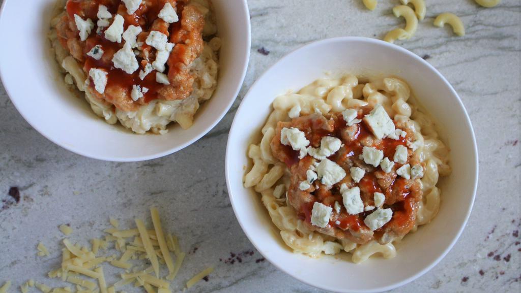 Buffalo Chicken Macaroni & Cheese · Topped with chicken, buffalo drizzle and blue cheese crumbles.