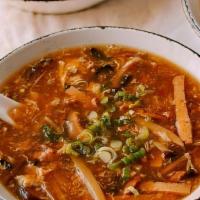 Hot & Sour Soup · Spicy. A blend of chicken, mushroom, and bamboo shoots cooked with tofu curds in a spicy bro...