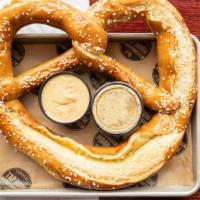 Giant Pretzel · Served with sides of beer mustard and queso cheese dip. / Any additional sauces will only be...
