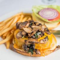 The Digman Cheese Burger · 1/2 lb. USDA prime burger, sautéed mushrooms, Cheddar cheese, lettuce, tomato, egg bun, fries.