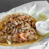 Chicken Gyro Sandwich · Chicken gyro slices, lettuce, tomatoes, onions, and tzatziki sauce; served over pita bread.