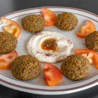 Falafel (6Pc) · Vegetarian. Ground chickpeas, parsley, onions, garlic, and spices; deep-fried, served with h...