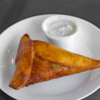 Beef Samboosa · Pastry filled with ground beef, vegetables, garlic, and spices; deep-fried and served with t...