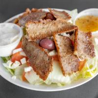 Gyro Salad · Greek salad topped with gyro slices; served with pita bread.