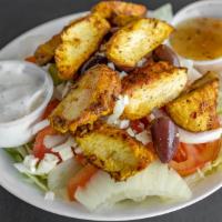 Chicken Kabob Salad · Greek salad topped with chicken kabob; served with pita bread.