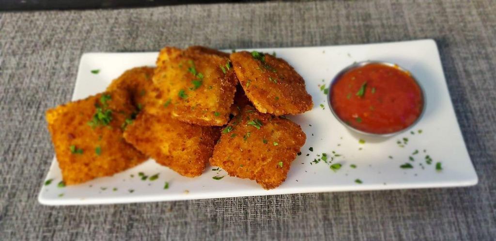 Fried Cheese Ravioli · Fried ravioli pasta filled with ricotta cheese and served with our marinara sauce.