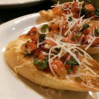 Bruschetta Di Pomodori · Tuscan garlic bread with fresh chopped tomatoes, basil and extra virgin olive oil.