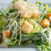 Caesar Salad - Small · Crisp romaine lettuce topped with fresh-grated Parmesan cheese and homemade croutons and cre...