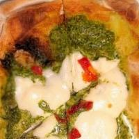 Pinsa Romana Pesto · 14x8 Artisan hand-crafted Roman-style pizza with pesto sauce, sun-dried tomatoes, and fresh ...