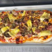 Pinsa Romana Capricciosa · 14x8 Artisan hand-crafted Roman-style pizza with tomato sauce, smoked mozzarella, prosciutto...