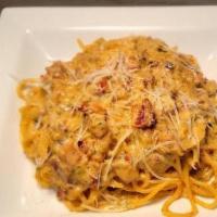 Spaghetti Alla Carbonara · Spaghetti prepared with eggs, pancetta (Italian cured and unsmoked pork bacon), ​parmesan ch...