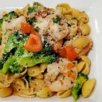 Orecchiette Baresi · Shell pasta with shrimp, broccoli and fresh tomatoes in garlic and olive oil sauce. Topped w...