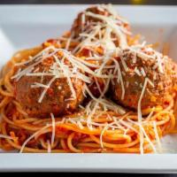 Spaghetti Con Polpette · Spaghetti in a marinara sauce accompanied by three giant homemade meatballs and topped with ...
