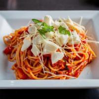 Spaghetti Al Pomodoro · Spaghetti noodles and tomato marinara topped with basil and fresh mozzarella cheese. Topped ...