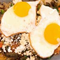 Greek Skillet · Gyro meat, onions, green pepper, tomato and hashbrowns, topped with feta cheese, two eggs, t...