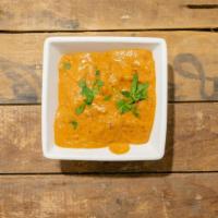 Chicken Tikka Masala · Clay oven cooked chicken cooked in rich creamy special zesty sauce and herbs with sprinkles ...