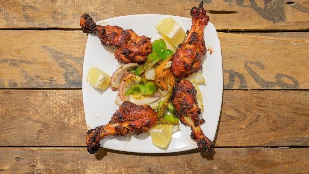 Tandoori Chicken Legs · Chicken legs marinated with ginger, yogurt, fresh ground spices and lemon juice then cooked in our clay oven.