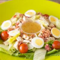 Cobb Salad · Romaine, iceberg, grilled chicken, avocado, bacon, egg,  crumbled Bleu cheese, and tomato wi...