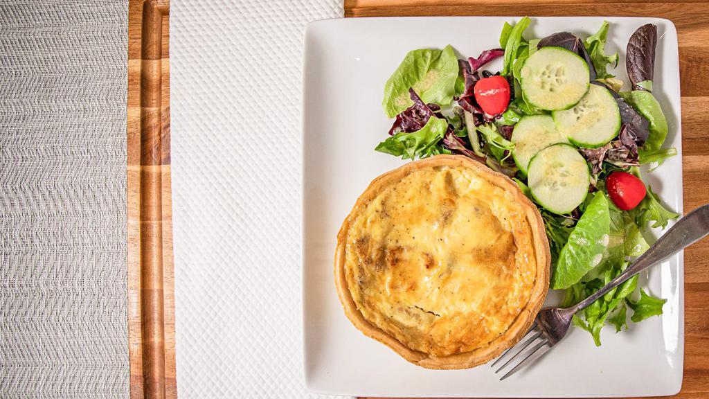Quiche Lorraine · Quiche is a savory, open pastry crust with savory custard with cheese blend and bacon.