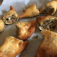 Beef Cheese & Cilantro Turnovers (4) · Beef wrapped in a crispy thin-breaded dough.