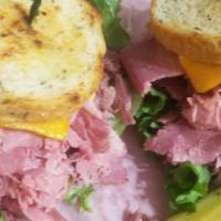 Reuben* · Corned Beef OR Pastrami, Swiss cheese and Sauerkraut on Grilled Rye Bread. --- Comes In 3 Si...