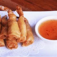 Fried Shrimp Spring Rolls · Marinated shrimp wrapped in spring roll skin, lightly fried, and
served with homemade sauce.