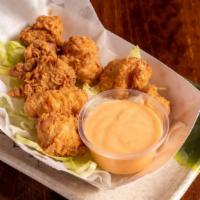 Gator Bites · Eight pieces. Alligator tenderloin, breaded, fried golden brown and served with remoulade.
