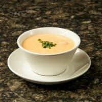 Lobster Bisque · Rich and creamy with succulent lobster.