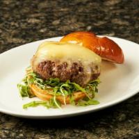 Wagyu Steakburger · Triple cream brie, arugula, garlic aioli, bacon-fat-brioche bun.