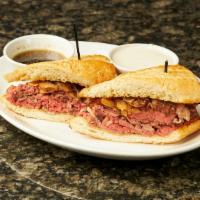 French Dip · Thinly shaved prime rib, caramelized onions, creamy horseradish, au jus served on a toasted ...